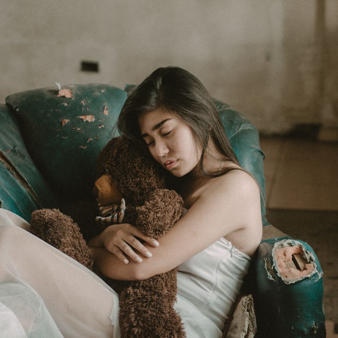 Woman Hugging A Teddy Bear